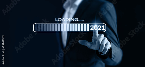 2021 concept. business man point hand to loading new year 2021. in the year 2021 is the year of technology with smart connect photo