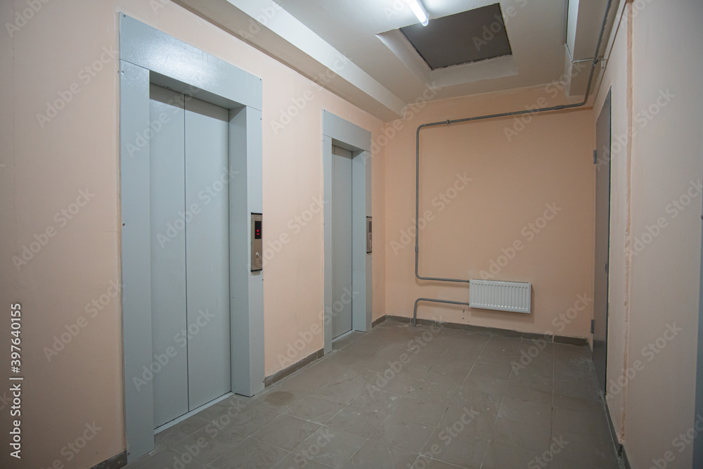 Doorway with elevators in an apartment building.