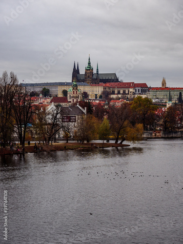 View on Prague Castle and Lesser Town from across the Vltava River on an autumn evening