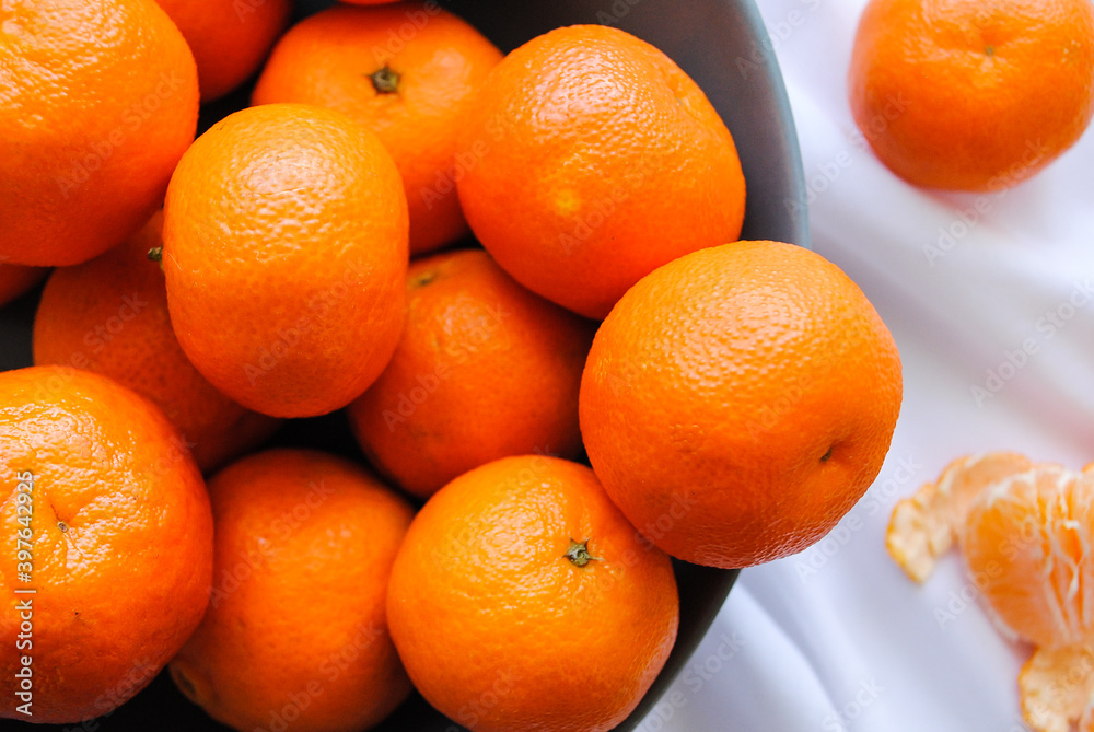 Ripe clementine tangerines close-up on the table. Ripe clementine tangerines close-up on the table.