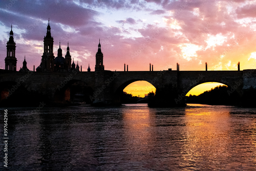 Naklejka premium river bridge at sunset