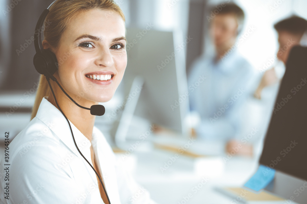 custom made wallpaper toronto digitalBlonde business woman using headset for communication and consulting people at customer service office. Call center. Group of operators at work