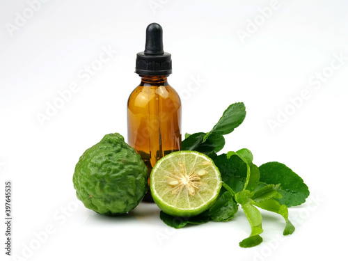 Herbs bergamot essential oil and fruit, isolated on white background.