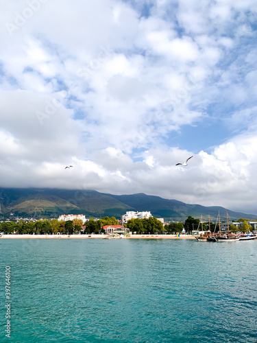 Sea, mountains and sky in white clouds