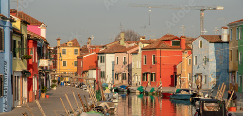 Fototapeta Brightly painted canalside houses in Burano