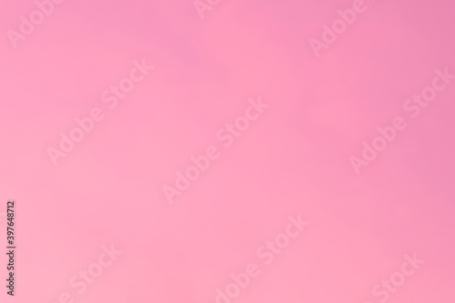 beautiful gradient clear pink light of sunset or sunrise morning sky without cloud. nature sky background. © gumpapa