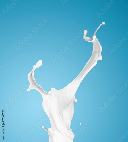 milk or white liquid splash on blue background.