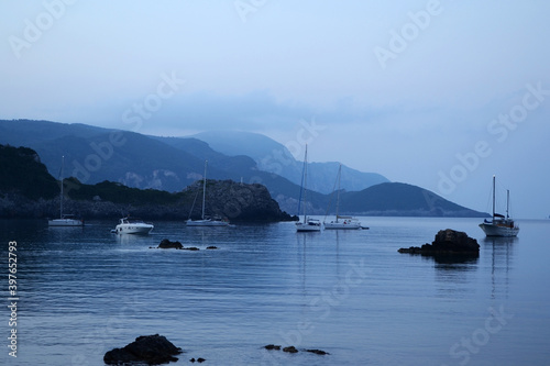 Yachts in one of the Paleokastritsa bays - Platakia Beach. Corfu, Greece. photo