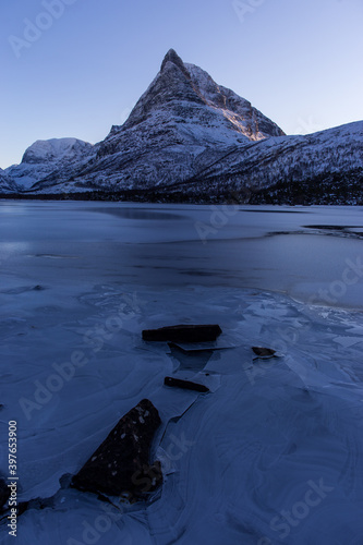 frozen lake inder moutain in Innerdalen Norway © Mrio