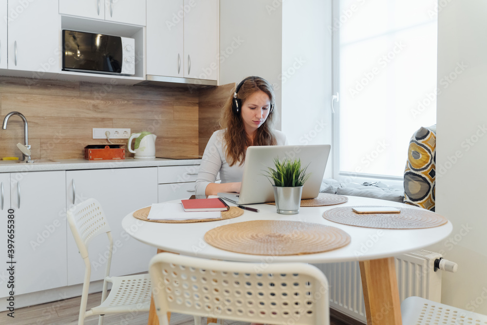 Stock Photo Of Woman Working With Laptop At Home Wearing Headphones