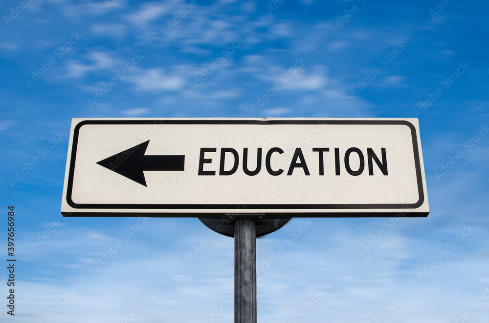 Education road sign, arrow on blue sky background. One way blank road sign with copy space. Arrow on a pole pointing in one direction. Education road sign, arrow on blue sky background. One way blank road sign with copy space. Arrow on a pole pointing in one direction.
