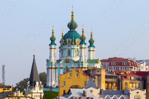 Amazing view of the slopes above the Dnieper in Kyiv, Ukraine. The ancient Baroque St. Andrew's Church rises above Andriyivskyy Uzviz and Vozdvyzhenka. photo