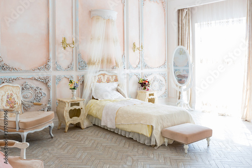 Luxurious expensive interior design of the children s room in the old Baroque style in beige colors