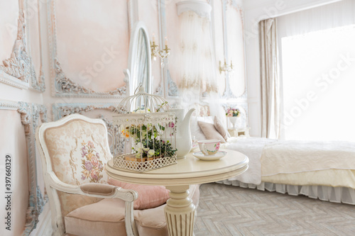 Luxurious expensive interior design of the children's room in the old Baroque style in beige colors