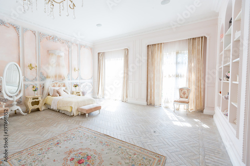Luxurious expensive interior design of the children s room in the old Baroque style in beige colors