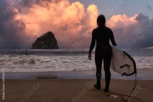 Photography Adventurous Girl with a Surf Board is going surfing in the Ocean