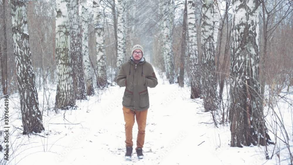 Man walking in a winter forest Man walking in a winter forest