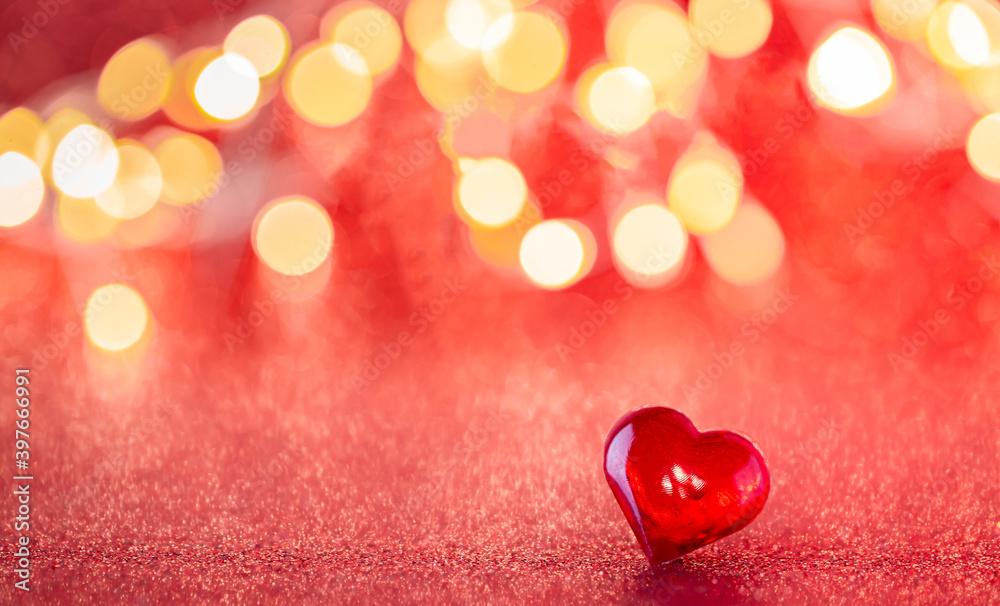The red Heart shapes on abstract red glitter background. Love concept for valentines day.