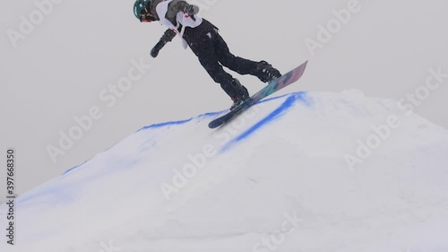 SLOW MOTION: Young pro snowboarder big air