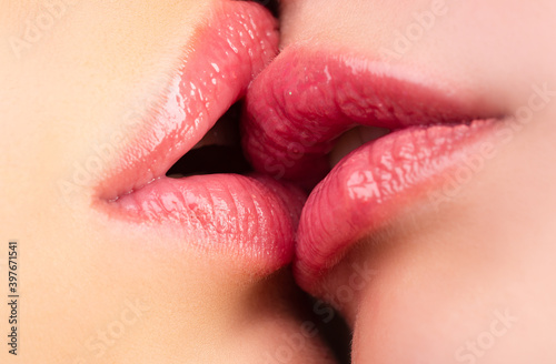 Lesbian kisses. Caucasian couple kissing. Kiss Close up.