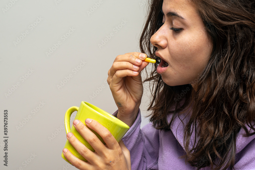 Sick female taking medicines. Pharmacy and healthcare concep Sick female taking medicines. Pharmacy and healthcare concep