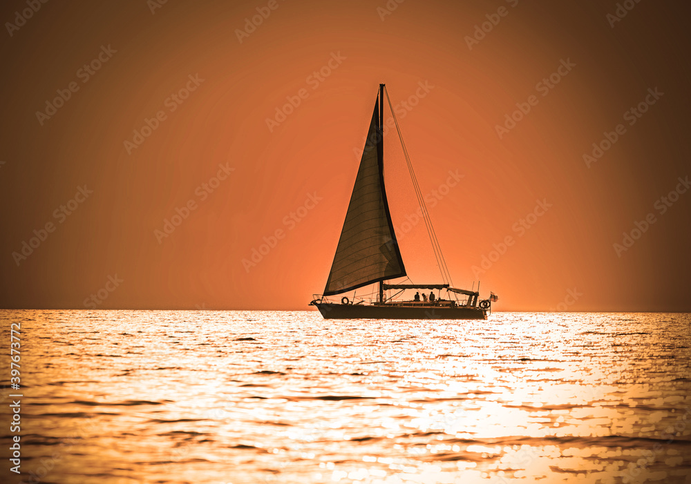 classic sail yacht at sunset