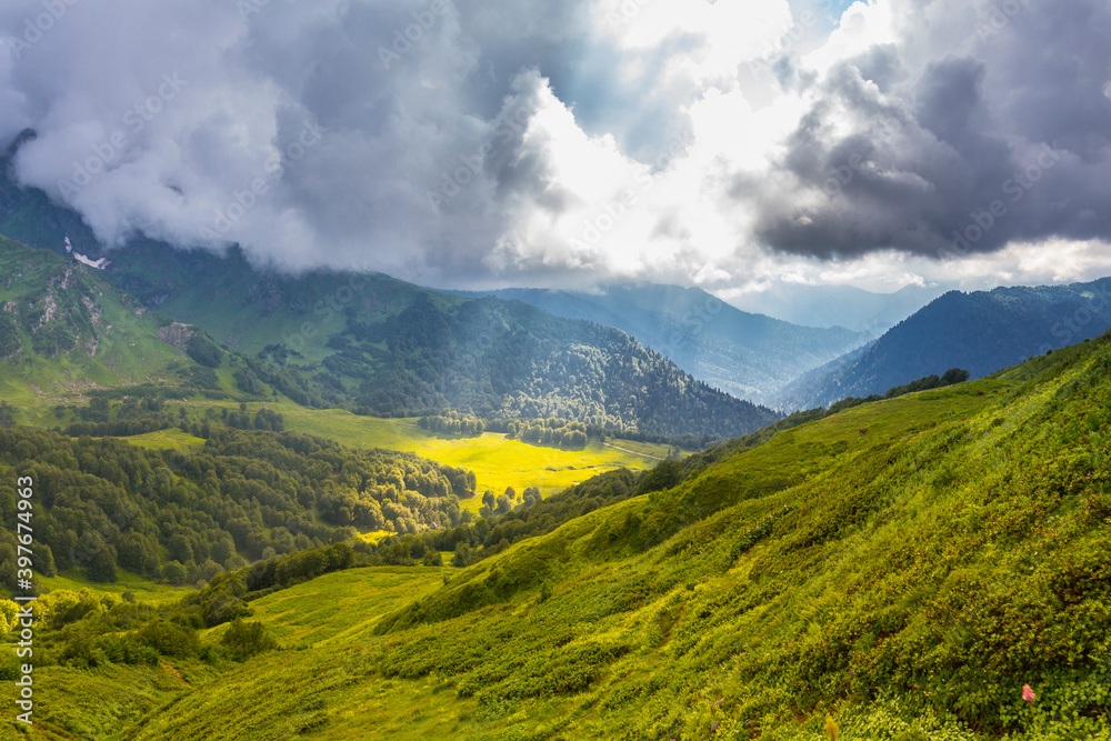 Beautiful mountain landscape with clouds at Caucasus mountains
