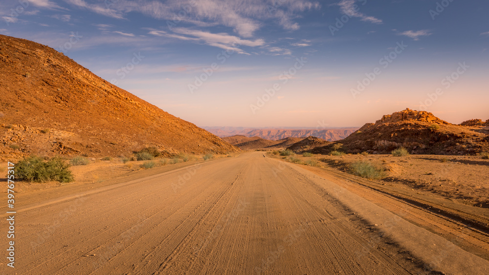 The roads of Namibia in Richtersveld Transfrontier Park near Fish River Canyon during sunset.