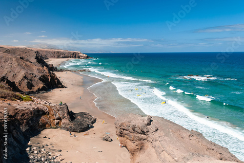 Canary island beach with surfers