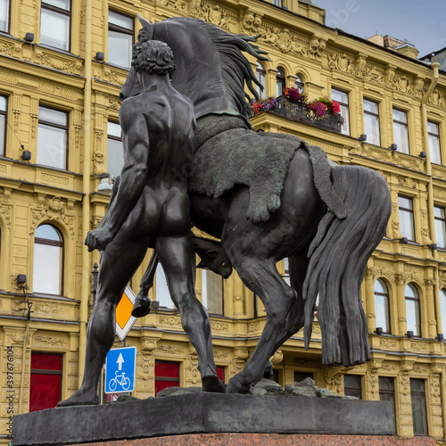 Equestrian sculptures on the Anichkov bridge over the Neva river in St. Petersburg, Russia