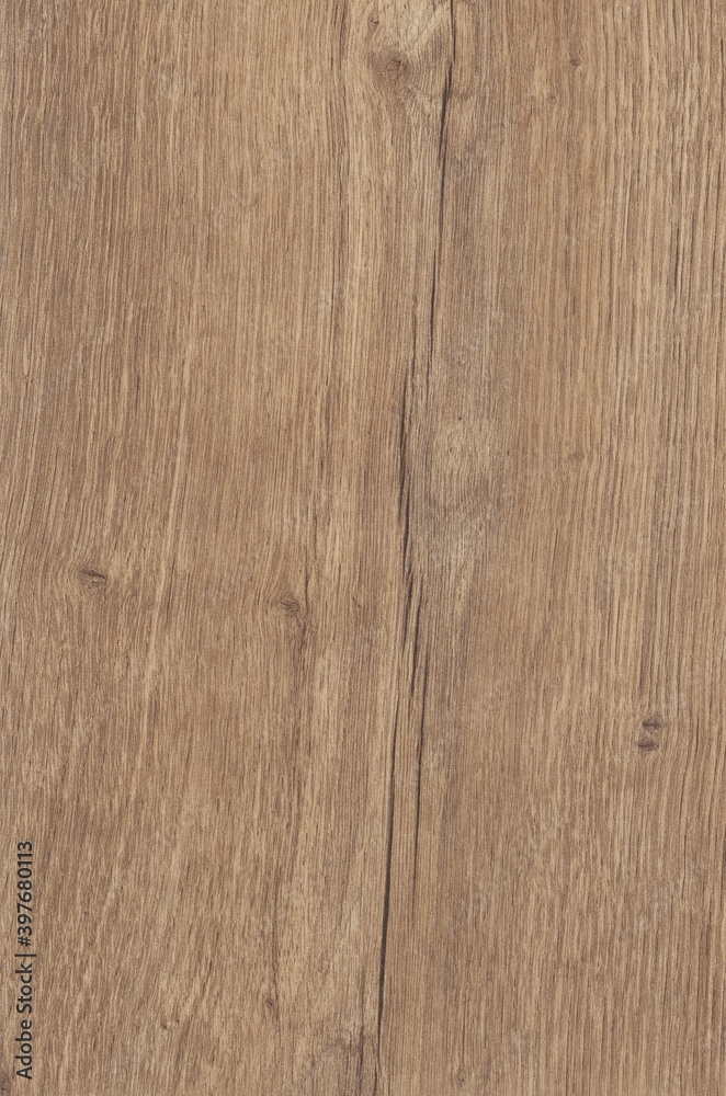Obraz premium The texture of freshly cut wood. Annual rings and cracks in the old tree. Horizontal wooden background. Texture in high resolution. Color image.