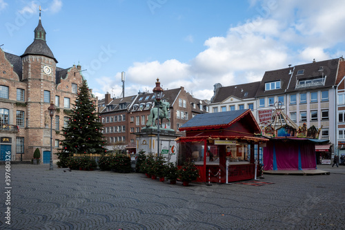 Outdoor scenery of silent Weihnachtsmarkt, Christmas Market at market square in front of old town hall in Düsseldorf, Germany during lockdown by epidemic COVID-19.