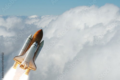Fototapeta Naklejka Na Ścianę i Meble -  Rocket spaceship. Blue skies. The elements of this image furnished by NASA.
