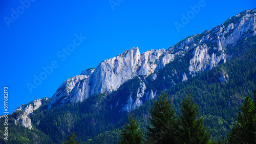 Piatra Craiului Mountains with their steep abysses in a clear summer day. Carpathia , Romania