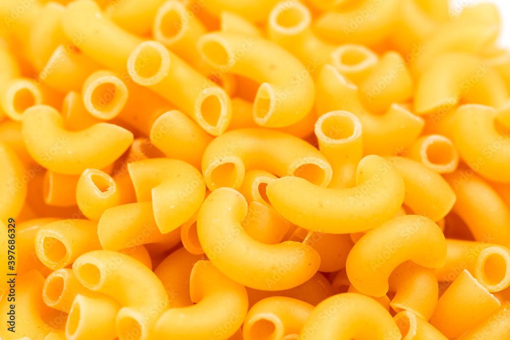 Raw Italian pasta in a heap on the table.