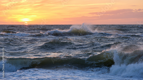 Stormy sea at sunset  Baltic  pink  orange  soft pastel colors  