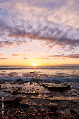 Sunrise on the rocky beach