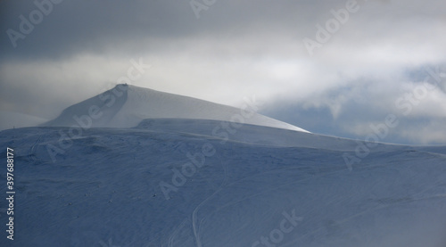 Carpathian winter mountain cloudy landscape.