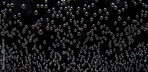air bubbles in the water isolated on black background