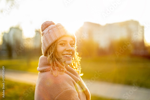Portrait Of Young Woman Wearing Warm Clothing During Winter 