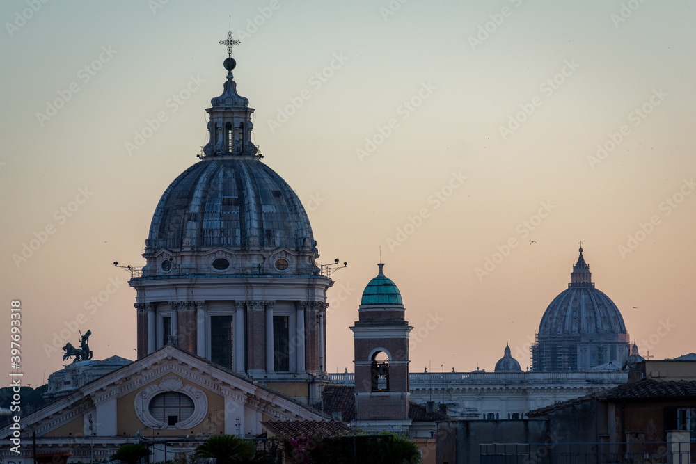 The Dome of Basilica of SS. Ambrose and Charles on the Corso and The Dome of St. Peter's Basilica