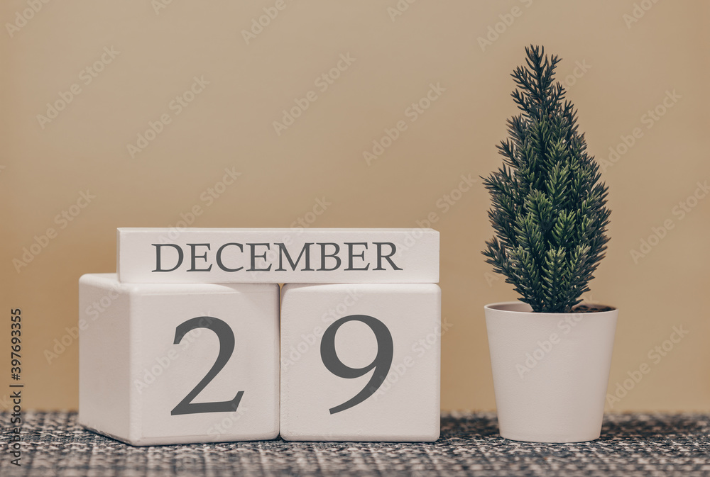 Desk calendar for use in different ideas. Winter month - December and the  number on the cubes 29. Calendar of holidays on a beige solid background.  Stock Photo | Adobe Stock