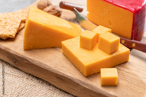Red waxed yellow cheddar cheese close up