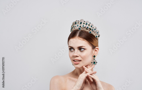 Beautiful woman naked shoulders and diadem jewelry princess jewelry