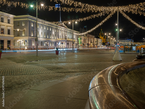 A nightly view of downtown Helsinki with Christmas lights decorations on the square.