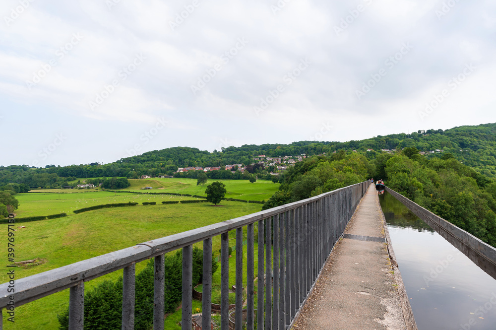 Pontcysyllte Aqueduct,  carries the Llangollen Canal waters across the River Dee in the Vale of Llangollen in Wales. 18 arched stone and cast iron structure is for use by canal narrow-boats. UK 