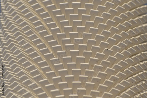 Pattern of white vanes on a heat dissipator or radiator. Part of utilities for a northern town.