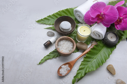 Lifestyle and Healthy Concept. Spa setting for massage treatment on gray background photo