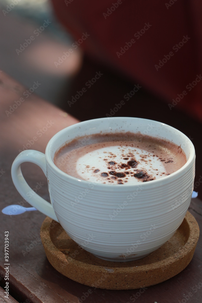 Close up hot chocolate in white ceramic cup Close up hot chocolate in white ceramic cup