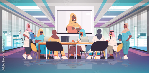 team of arabic medical specialists having video conference with female black muslim doctor medicine healthcare concept hospital meeting room interior horizontal full length vector illustration